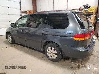 2003 Honda Odyssey EX with VIN 2HKRL18603H008412, listed as a Copart auction lot 87502365 with 352,773 mi miles and Salvage Title. Bid and sale history available at DreamBid. Image 2.