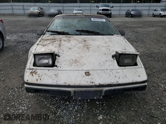 1984 Pontiac Fiero z VIN 1G2AF37R6EP320306, wystawiony jako Copart lot #68255394 z przebiegiem 49 284 mil mil oraz Czysty tytuł • Clean title. Historia ofert i sprzedaży dostępna na DreamBid. Obrazek 5.