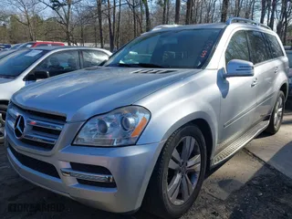 2011 Mercedes-Benz GL-Class GL 450 with VIN 4JGBF7BE1BA660453, listed as a IAAI auction lot 41852431 with 143,084 mi miles. Bid and sale history available at carsss.com. Image 2.