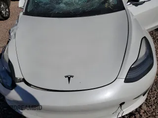 2020 Tesla Model 3 Standard Range Plus with VIN 5YJ3E1EA4LF799597, listed as a Copart auction lot 76401374 with 77,506 mi miles and Salvage Title. Bid and sale history available at DreamBid. Image 12.