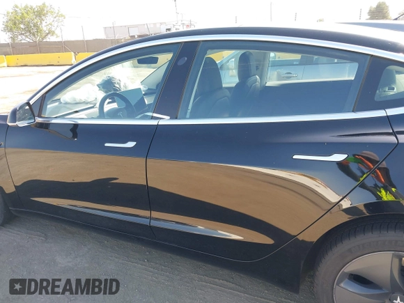 2018 Tesla Model 3 Long Range Battery with VIN 5YJ3E1EA7JF057031, listed as a IAAI auction lot 42139832 with 92,618 mi miles and . Bid and sale history available at DreamBid. Image 13.