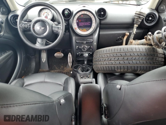 2014 MINI Countryman S with VIN WMWZC5C58EWP39797, listed as a Copart auction lot 62193515 with 84,989 mi miles and Salvage title. Bid and sale history available at DreamBid. Image 8.