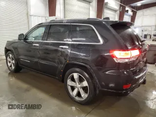 2015 Jeep Grand Cherokee Overland with VIN 1C4RJFCG7FC911899, listed as a Copart auction lot 54123925 with 243,031 mi miles and Salvage Title. Bid and sale history available at carsss.com. Image 2.