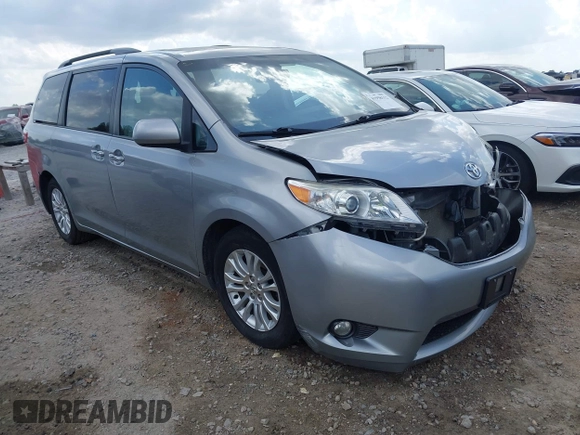 2015 Toyota Sienna XLE with VIN 5TDYK3DC7FS659864, listed as a IAAI auction lot 41958112 with 121,257 mi miles and . Bid and sale history available at DreamBid. Image 1.
