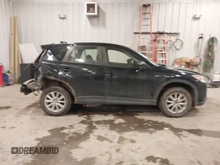 2015 Mazda CX-5 Sport with VIN JM3KE4BY0F0542655, listed as a IAAI auction lot 41471568 with 165,386 mi miles. Bid and sale history available at carsss.com. Image 13.