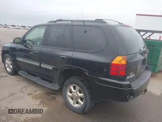 2002 GMC Envoy SLT with VIN 1GKDT13S222143135, listed as a IAAI auction lot 42136672 with 206,064 mi miles. Bid and sale history available at carsss.com. Image 3.
