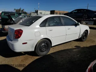 2004 Suzuki Forenza S z VIN KL5JD52Z14K950658, wystawiony jako Copart lot #74824154 z przebiegiem 99 150 mil mil oraz Tytuł czysty. Historia ofert i sprzedaży dostępna na DreamBid. Obrazek 3.