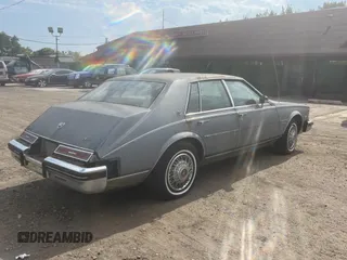 1982 Cadillac Seville z VIN 1G6AS6989CE694210, wystawiony jako Copart lot #74978254 z przebiegiem 21 412 mil mil oraz Tytuł czysty. Historia ofert i sprzedaży dostępna na DreamBid. Obrazek 4.