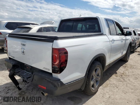2021 Honda Ridgeline RTL-E with VIN 5FPYK3F78MB005044, listed as a Copart auction lot 63120882 with Not provided miles and . Bid and sale history available at DreamBid. Image 4.