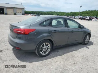 2017 Ford Focus SE with VIN 1FADP3F2XHL201380, listed as a Copart auction lot 56942815 with 136,169 mi miles and Salvage title. Bid and sale history available at DreamBid. Image 3.