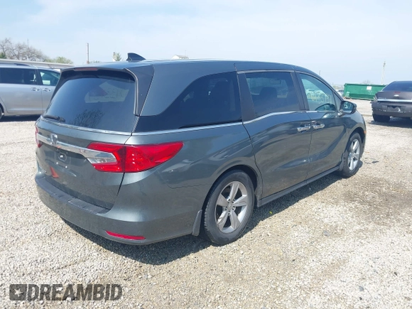 2018 Honda Odyssey EX-L z VIN 5FNRL6H77JB096733, wystawiony jako IAAI lot #42133737 z przebiegiem 165 069 mil mil oraz . Historia ofert i sprzedaży dostępna na DreamBid. Obrazek 4.
