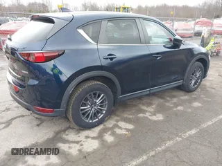 2021 Mazda CX-5 Touring with VIN JM3KFBCM7M1380396, listed as a IAAI auction lot 41707612 with 55,555 mi miles. Bid and sale history available at carsss.com. Image 4.