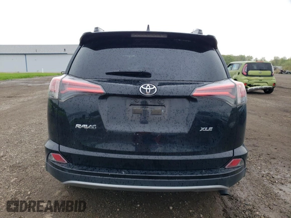 2018 Toyota RAV4 XLE with VIN 2T3WFREV0JW484430, listed as a Copart auction lot 55878455 with 132,335 mi miles and Salvage title. Bid and sale history available at DreamBid. Image 6.