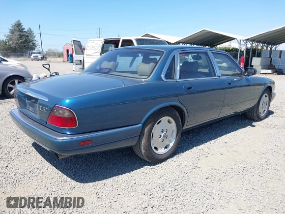 1996 Jaguar XJ with VIN SAJHX1740TC766425, listed as a IAAI auction lot 42758458 with 257,849 mi miles and . Bid and sale history available at DreamBid. Image 4.