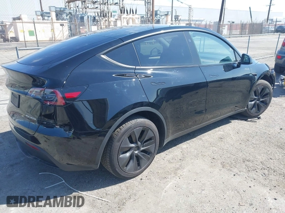 2025 Tesla Model Y Long Range with VIN 7SAYGDEE9SF278607, listed as a IAAI auction lot 41932084 with 9,667 mi miles and . Bid and sale history available at carsss.com. Image 4.