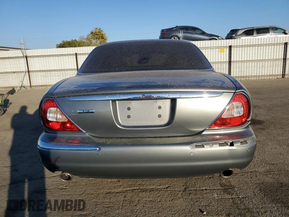 2004 Jaguar XJ with VIN SAJWA71C74SG20299, listed as a Copart auction lot 79469504 with 78,134 mi miles and Salvage Title. Bid and sale history available at carsss.com. Image 6.