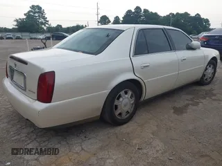 2002 Cadillac DeVille z VIN 1G6KD54Y92U130111, wystawiony jako IAAI lot #42439252 z przebiegiem 194 669 mil mil oraz . Historia ofert i sprzedaży dostępna na DreamBid. Obrazek 4.