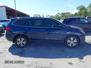 2016 Honda Pilot EX with VIN 5FNYF5H3XGB021575, listed as a IAAI auction lot 41853099 with 141,848 mi miles. Bid and sale history available at carsss.com. Image 14.