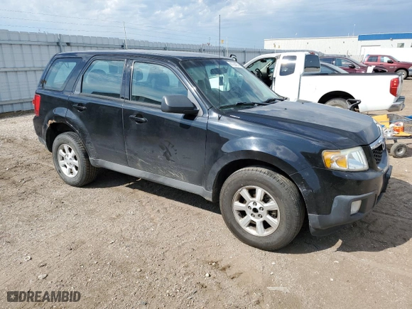 2010 Mazda Tribute Touring with VIN 4F2CY9C75AKM02945, listed as a Copart auction lot 67784674 with 134,363 mi miles and Salvage Title. Bid and sale history available at carsss.com. Image 4.