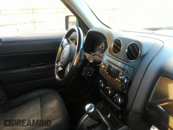 2014 Jeep Patriot Latitude with VIN 1C4NJRFB0ED799097, listed as a IAAI auction lot 40834502 with 192,940 mi miles. Bid and sale history available at carsss.com. Image 5.