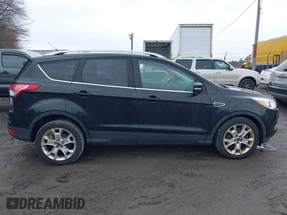 2014 Ford Escape Titanium with VIN 1FMCU9J99EUD38866, listed as a IAAI auction lot 42052579 with 202,337 mi miles. Bid and sale history available at carsss.com. Image 13.