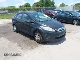 2013 Ford Fiesta SE z VIN 3FADP4BJ8DM218657, wystawiony jako IAAI lot #42361329 z przebiegiem 96 547 mil mil oraz . Historia ofert i sprzedaży dostępna na DreamBid. Obrazek 1.
