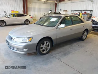 2001 Lexus ES 300 with VIN JT8BF28G710305676, listed as a IAAI auction lot 42142188 with 210,453 mi miles. Bid and sale history available at carsss.com. Image 2.