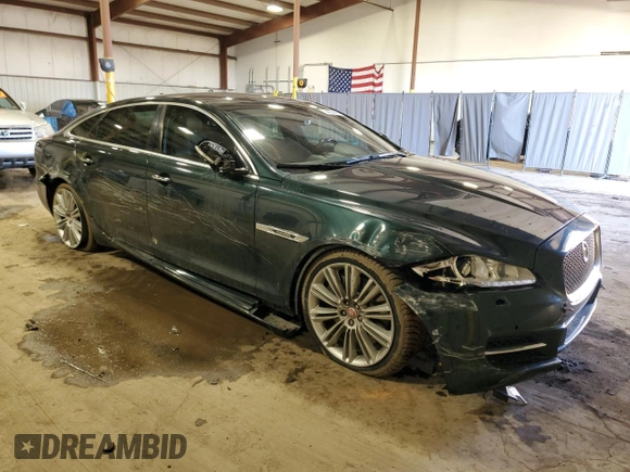 2014 Jaguar XJ with VIN SAJWA2GTXEMV72147, listed as a Copart auction lot 44854485 with 103,814 mi miles and Salvage Title. Bid and sale history available at DreamBid. Image 4.
