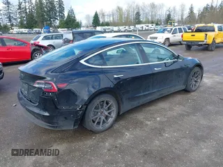2019 Tesla Model 3 Mid Range with VIN 5YJ3E1EA4KF305611, listed as a IAAI auction lot 41916738 with 59,101 mi miles and . Bid and sale history available at carsss.com. Image 4.