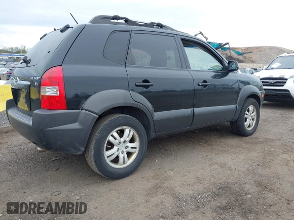 2007 Hyundai Tucson SE with VIN KM8JN12D77U667867, listed as a IAAI auction lot 42082092 with 240,911 mi miles. Bid and sale history available at carsss.com. Image 4.
