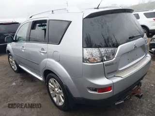 2009 Mitsubishi Outlander SE z VIN JA4MT31W89Z003101, wystawiony jako IAAI lot #41487678 z przebiegiem 90 226 mil mil oraz . Historia ofert i sprzedaży dostępna na DreamBid. Obrazek 3.