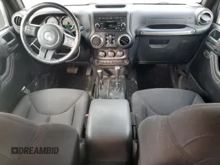 2018 Jeep Wrangler JK Unlimited Sport S with VIN 1C4BJWDG1JL907517, listed as a Copart auction lot 77398184 with 60,217 mi miles and Salvage Title. Bid and sale history available at carsss.com. Image 8.