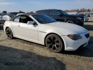 2005 BMW 6 Series 645Ci with VIN WBAEK73445B327467, listed as a Copart auction lot 82339674 with 135,052 mi miles and Salvage Title. Bid and sale history available at carsss.com. Image 4.