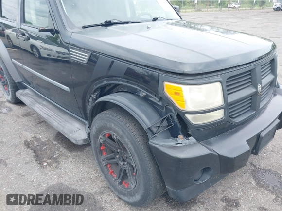2007 Dodge Nitro SXT with VIN 1D8GT28K17W605984, listed as a IAAI auction lot 41970841 with 118,700 mi miles. Bid and sale history available at carsss.com. Image 6.