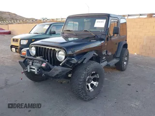 2004 Jeep Wrangler SE with VIN 1J4FA29184P762210, listed as a IAAI auction lot 40983051 with 107,525 mi miles and . Bid and sale history available at DreamBid. Image 2.