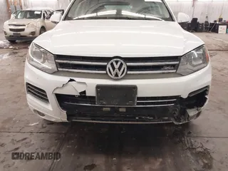 2013 Volkswagen Touareg Lux with VIN WVGEF9BP5DD011511, listed as a IAAI auction lot 41608840 with 167,350 mi miles and . Bid and sale history available at DreamBid. Image 6.