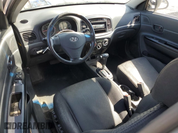 2007 Hyundai Accent SE z VIN KMHCN36C47U027122, wystawiony jako Copart lot #52224605 z przebiegiem 169 022 mil mil oraz Szkoda całkowita • Salvage title. Historia ofert i sprzedaży dostępna na DreamBid. Obrazek 8.