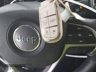 2018 Jeep Grand Cherokee Laredo E with VIN 1C4RJFAG1JC499457, listed as a IAAI auction lot 41379459 with 127,344 mi miles and . Bid and sale history available at DreamBid. Image 11.