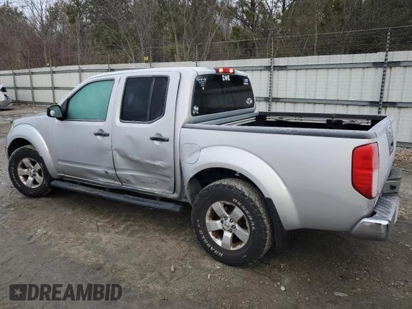 2010 Nissan Frontier SE with VIN 1N6AD0EV2AC405609, listed as a Copart auction lot 87615465 with 170,555 mi miles and Salvage title. Bid and sale history available at DreamBid. Image 2.