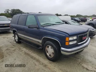 1999 GMC Yukon with VIN 1GKEK13R2XJ739931, listed as a Copart auction lot 74583734 with 115,605 mi miles and Salvage Title. Bid and sale history available at carsss.com. Image 4.