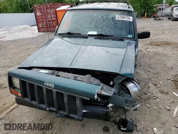 1998 Jeep Cherokee Sport z VIN 1J4FJ68S4WL101110, wystawiony jako Copart lot #57696755 z przebiegiem 218 254 mil mil oraz Szkoda całkowita • Salvage title. Historia ofert i sprzedaży dostępna na DreamBid. Obrazek 14.