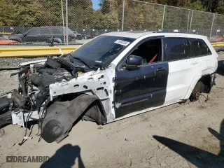 2021 Jeep Grand Cherokee SRT with VIN 1C4RJFDJ5MC584989, listed as a Copart auction lot 71048734 with 68,774 mi miles and Salvage Title. Bid and sale history available at carsss.com. Image 1.