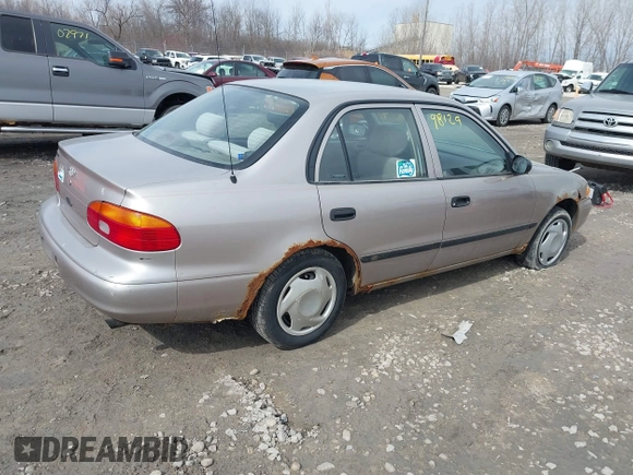 1999 Chevrolet Prizm z VIN 1Y1SK5488XZ446950, wystawiony jako IAAI lot #41798129 z przebiegiem 292 798 mil mil oraz . Historia ofert i sprzedaży dostępna na DreamBid. Obrazek 4.