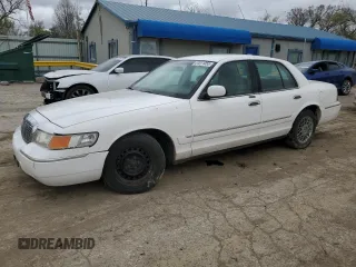 1999 Mercury Grand Marquis GS z VIN 2MEFM74W0XX670924, wystawiony jako Copart lot #51811055 z przebiegiem 176 559 mil mil oraz Szkoda całkowita • Salvage title. Historia ofert i sprzedaży dostępna na DreamBid. Obrazek 1.