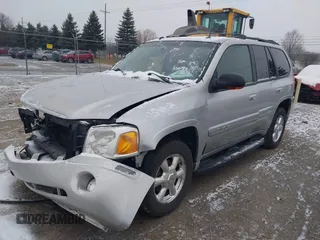 2005 GMC Envoy SLT with VIN 1GKDT13S352258640, listed as a IAAI auction lot 41226997 with 159,665 mi miles. Bid and sale history available at carsss.com. Image 17.