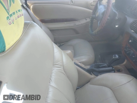 2000 Chrysler Sebring JXi z VIN 3C3EL55H2YT235270, wystawiony jako IAAI lot #41361520 z przebiegiem Nie podano mil oraz . Historia ofert i sprzedaży dostępna na DreamBid. Obrazek 5.
