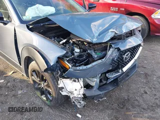 2023 Mazda CX-30 S Carbon Edition with VIN 3MVDMBCM0PM510726, listed as a IAAI auction lot 41150274 with 18,394 mi miles and . Bid and sale history available at DreamBid. Image 6.
