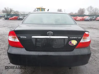 2003 Toyota Camry LE with VIN 4T1BE30K13U144114, listed as a IAAI auction lot 41829879 with 60,385 mi miles and . Bid and sale history available at DreamBid. Image 16.