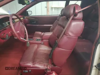1992 Cadillac Eldorado z VIN 1G6EL13B8NU614555, wystawiony jako Copart lot #73767514 z przebiegiem 88 448 mil mil oraz Tytuł czysty. Historia ofert i sprzedaży dostępna na DreamBid. Obrazek 7.