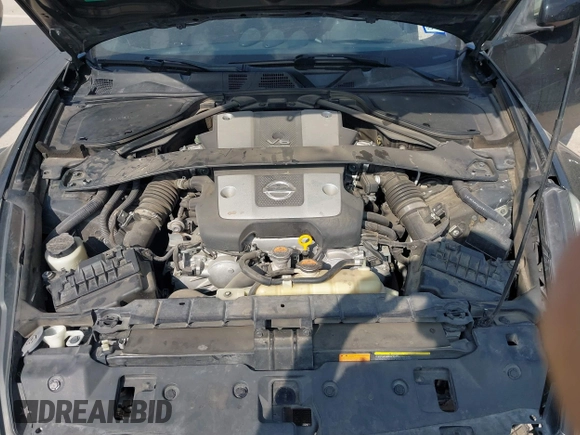 2015 Nissan 370Z z VIN JN1AZ4EH2FM442556, wystawiony jako IAAI lot #41956287 z przebiegiem 128 769 mil mil oraz . Historia ofert i sprzedaży dostępna na DreamBid. Obrazek 10.